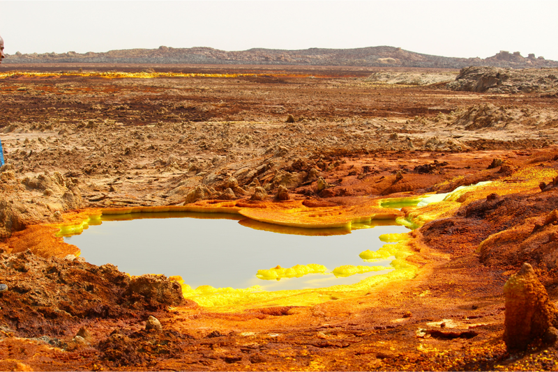 Hydrothermal lake at the Danakil Depression featuring sulfates (yellow) and iron oxide deposits (red). Image: Felipe Gomez/Europlanet 2020 RI